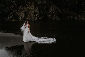 An Ivory embroidered Bespoke Wedding dress gown made with metres of tulle and a hand stitch feather lace bodice